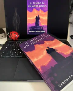 Instagram post: the paperback lying on a laptop